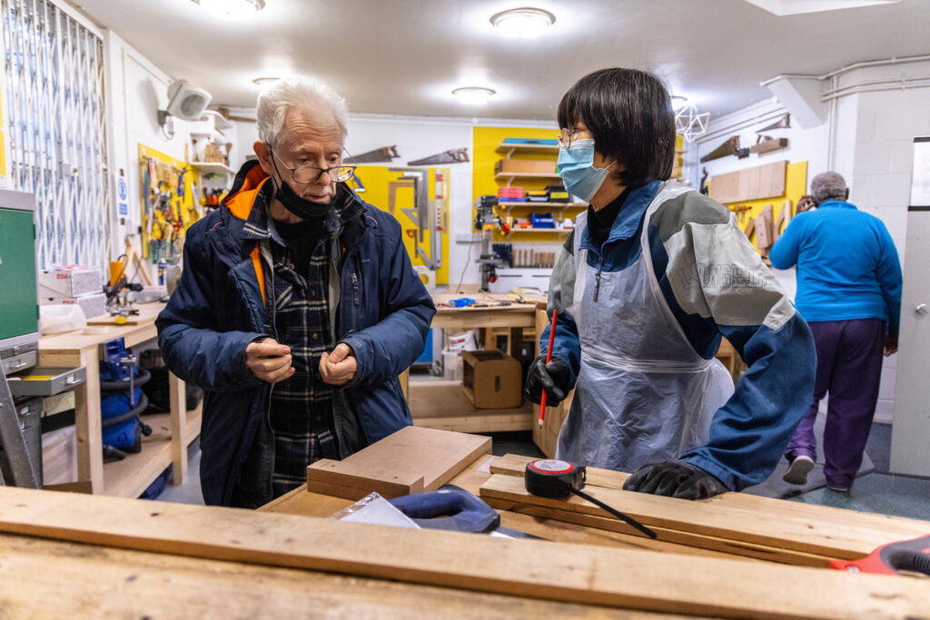 A group of people working together in a makerspace