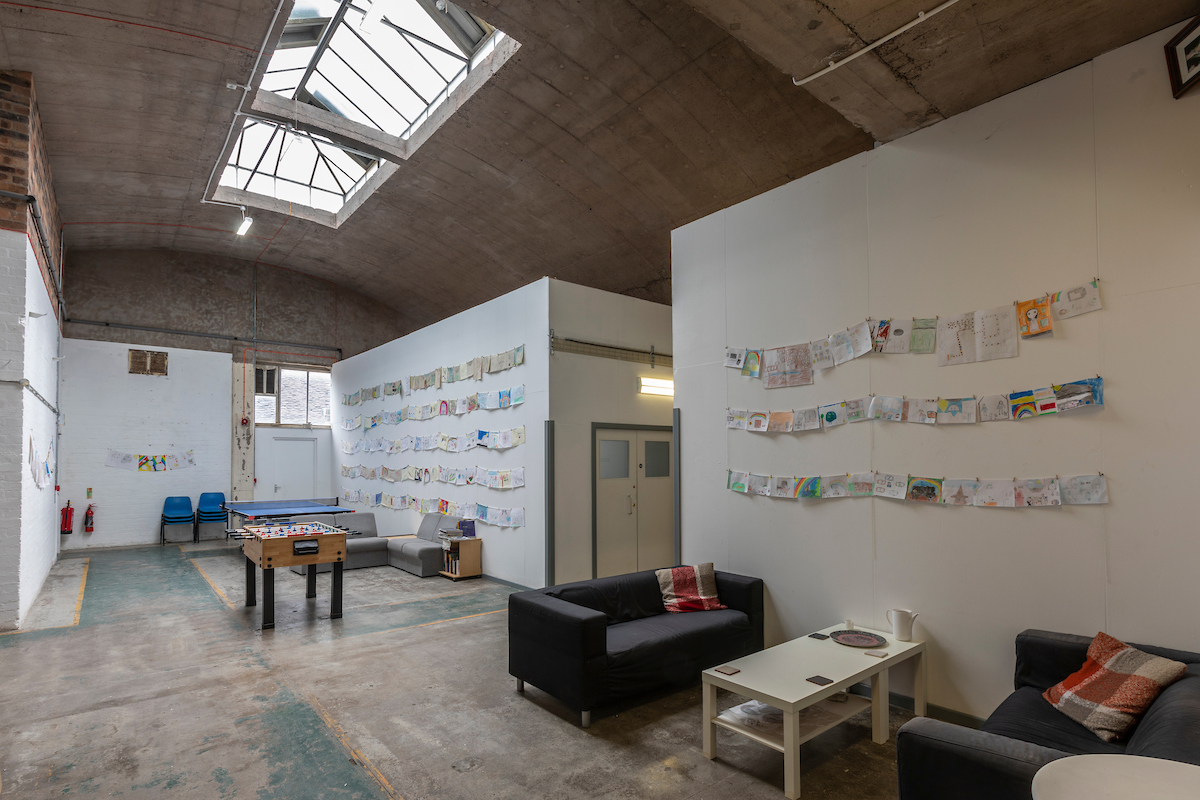 Spode Works Studios communal area with sofas, ping pong table and shared gallery space.