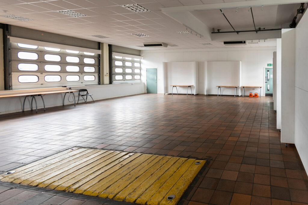 Photograph of a large hall in an old fire station building