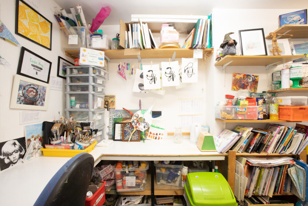 Close up of a busy artist's work table