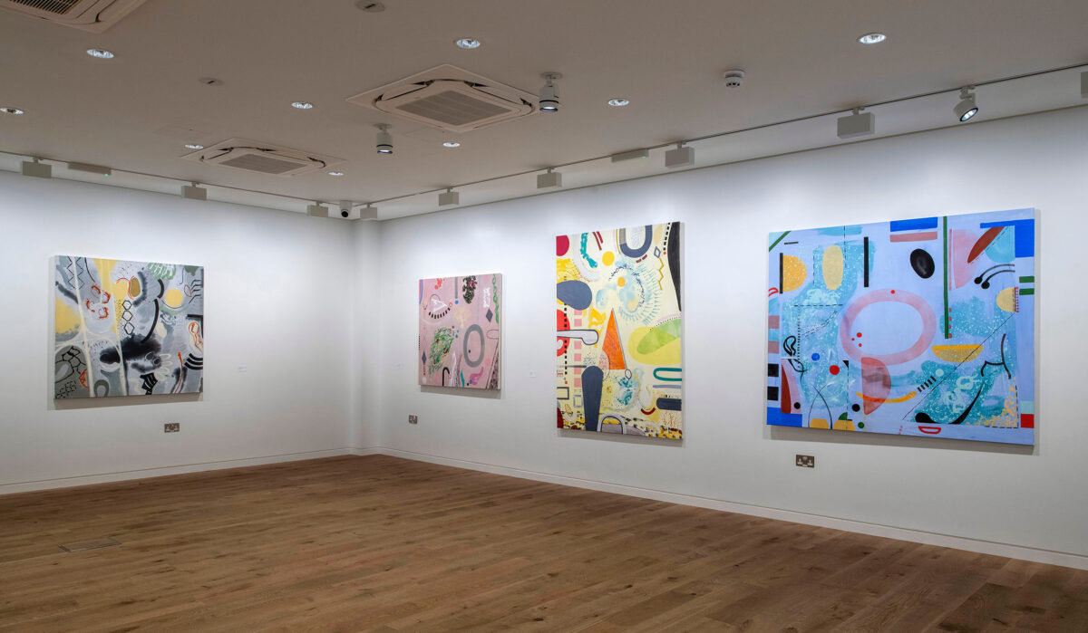 Exhibition view of four large colourful abstract paintings in a bright and spacious art gallery.